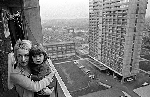 Mother and daughter on the balcony of their 13th floor tower block flat Leytonstone  (1974)