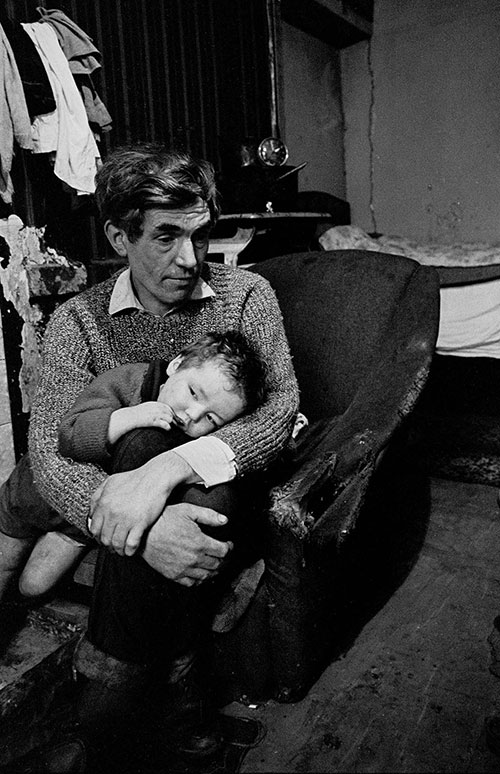 Father and child living in a condemned Gorbals tenement, Glasgow  (1970)