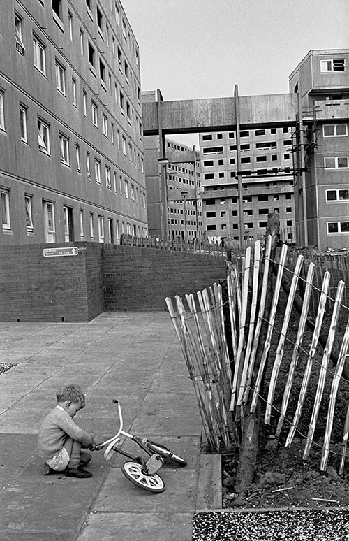 Child playing amongst the new construction in Killingworth New Town, Northumberland  (1975)