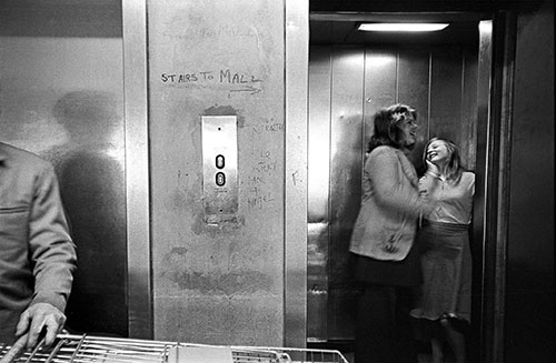 Girls in a lift in a shopping complex Birmingham  (1975)
