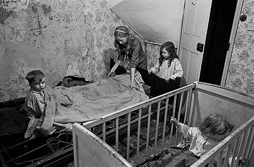 Mrs M puts her children to bed in their Balsall Heath slum 2, Birmingham  (1969)