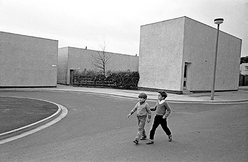 Childen walking past award winning houses Killingworth New Town Northumberland  (1975)