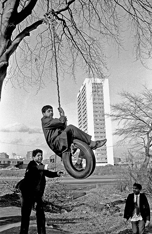 Boys playing by a new tower block Birmingham  (1975)