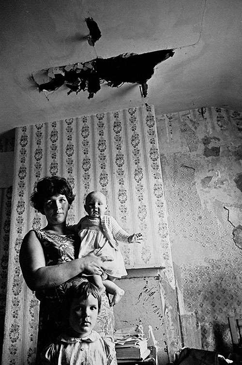 Mother and her children in their decaying Birmingham home  (1969)