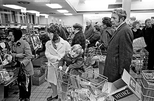 Family in a queue, supermarket Northfiel Birmingham  (1975)