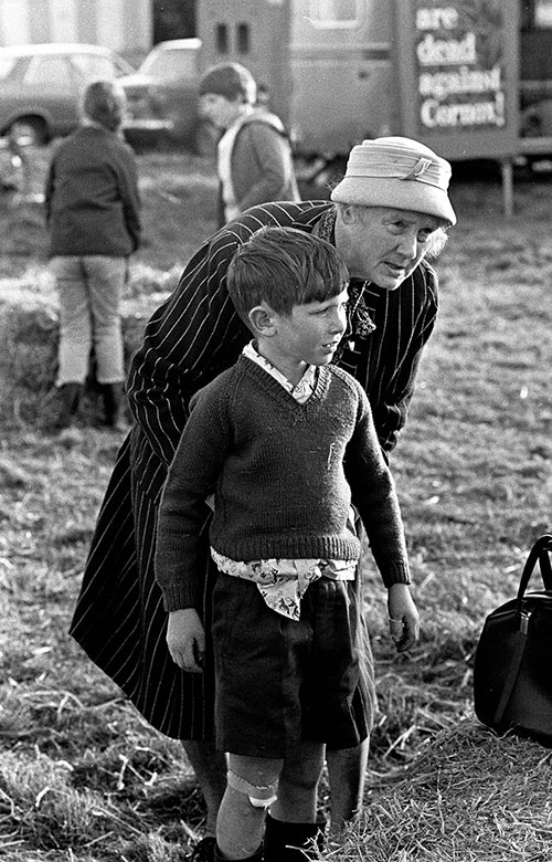 Granny tucks a boy's shirt in, agricultural show, Bromsgrove  (1967)