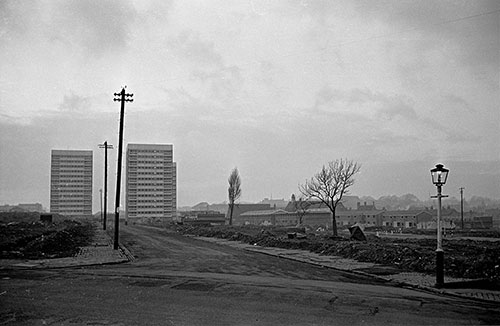Tower blocks advance across a slum cleared site , Hockley Birmingham  (1967)