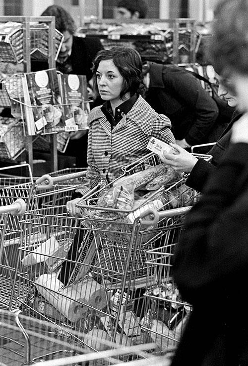 Woman in a supermarket queue, Birmingham  (1975)