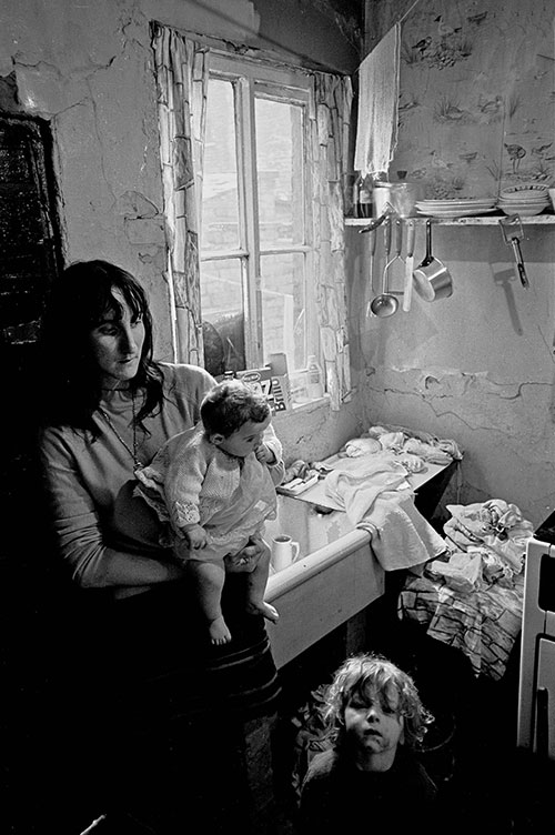Mother and children in their Salford kitchen, (1971)